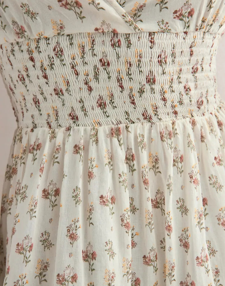 Neo Noir Magda Feiner Druck Cremefarbenes Neckholder-Minikleid mit Blumenmuster – gesmokte Taille, offener Rücken | Damen