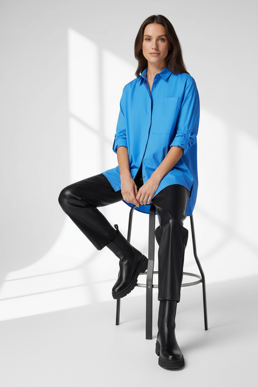 Lifestyle shot - woman in s.Oliver blue shirt sitting on stool