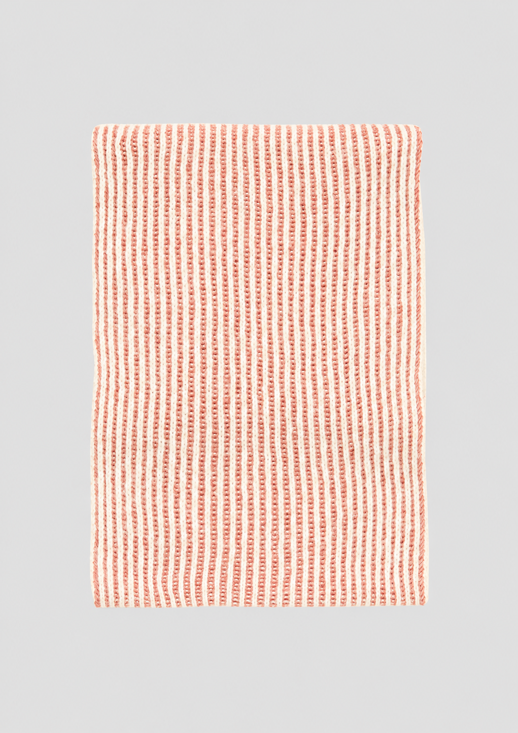s.Oliver pink and cream ribbed snood laid flat to show its rectangular shape and striped knit.